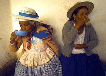 Women drink the traditional "Chicha"